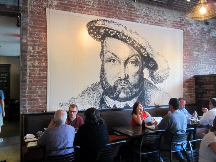 Andy, John and Karen eating under the watchful eye of Henry VIII.