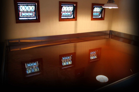 The Allagash coolship.  Notice the open stained glass windows to let the wild yeast and bacteria drift in.  (Image taken from Allagash's website)