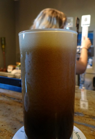 The nitro cascade on display in glass of Fat Julian.
