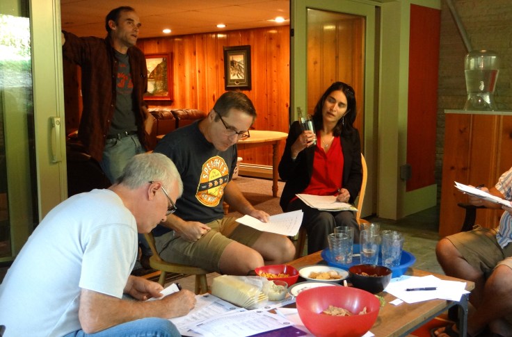 George takes careful notes while Hannah and Ted debate the merits of southern hemisphere hops.