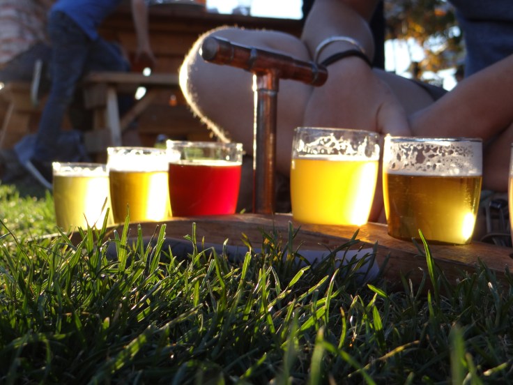 Enjoying a tasting flight on the lawn at Crux.