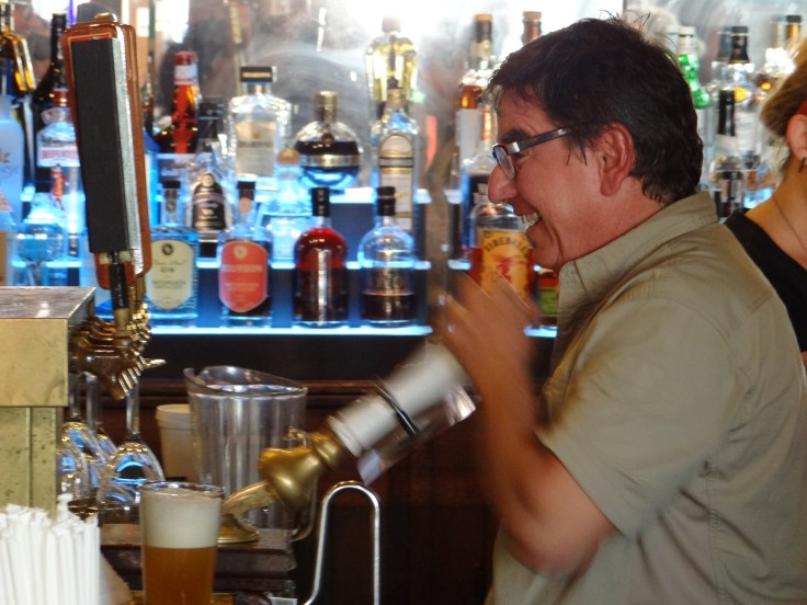 Angelo pours a pint of Centennial IPA from one of the beer engines at Barley's.